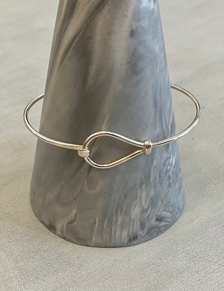 
            
                Load image into Gallery viewer, LOVE KNOT SILVER BANGLE
            
        